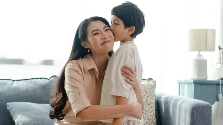030520800_1766372224-087668000_1703077982-happy-asian-tender-son-kisses-mother-mother-s-day-during-h.jpeg