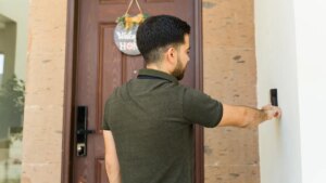 man-at-doorbell-gettyimages-2158163068.jpg