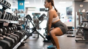 person-doing-squat-at-gym.jpg