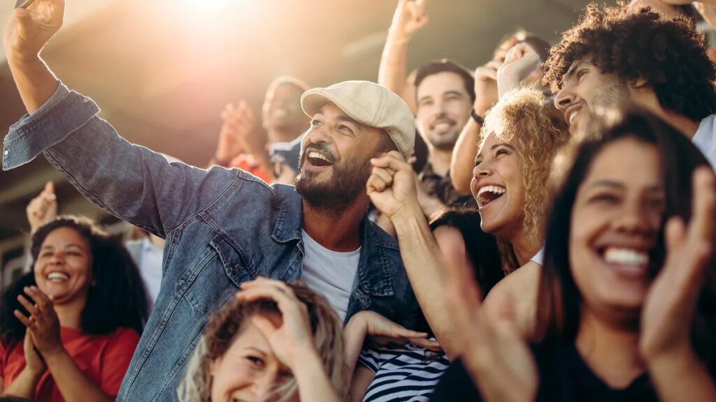 group-of-supporters-taking-selfie-watching-a-football-match-jacob-lund-adobe-stock.jpg