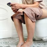 person-on-phone-toilet.jpg