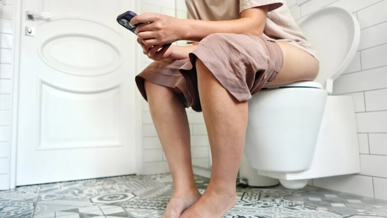 person-on-phone-toilet.jpg