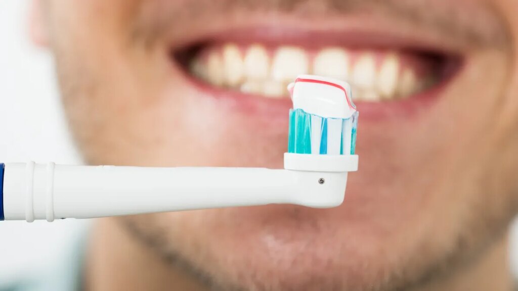 person-using-electric-toothbrush.jpg