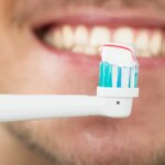 person-using-electric-toothbrush.jpg